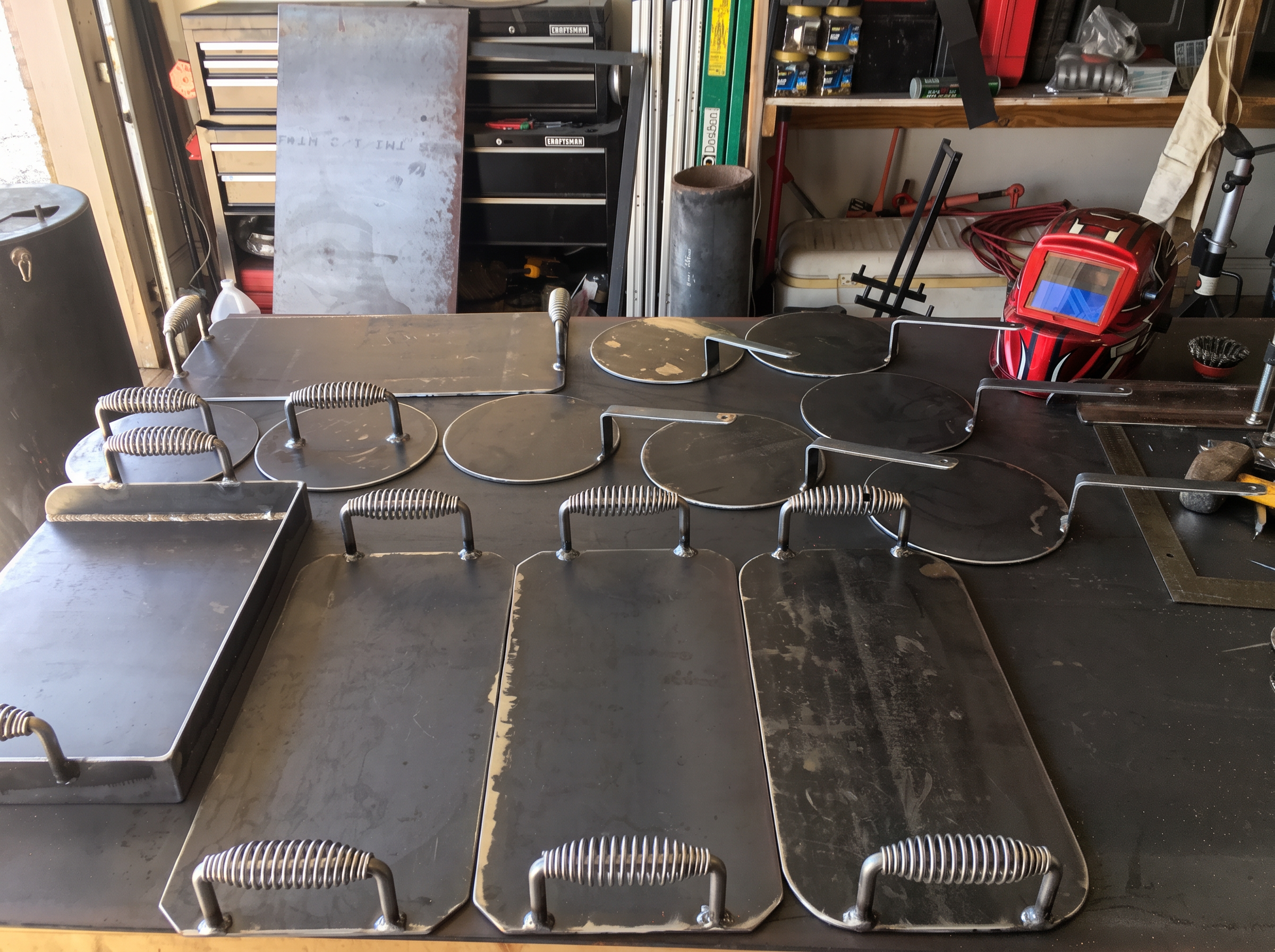 Welding helmet and metalwork in Martin's shop